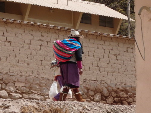 A Mommy, Baby, and Daughter are walking.